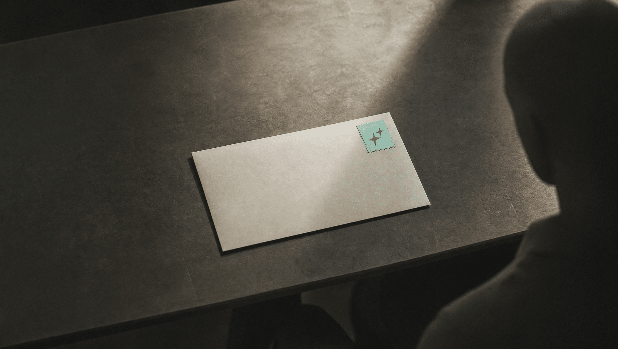 A single envelope on a desk with its address panel blank and one mint stamp in the corner, picturing a statistic with no source.